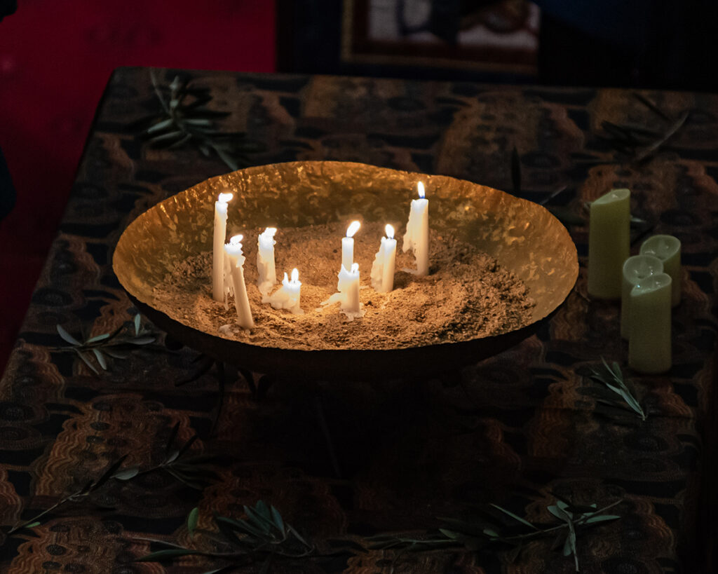 Each speaker lit a candle for peace